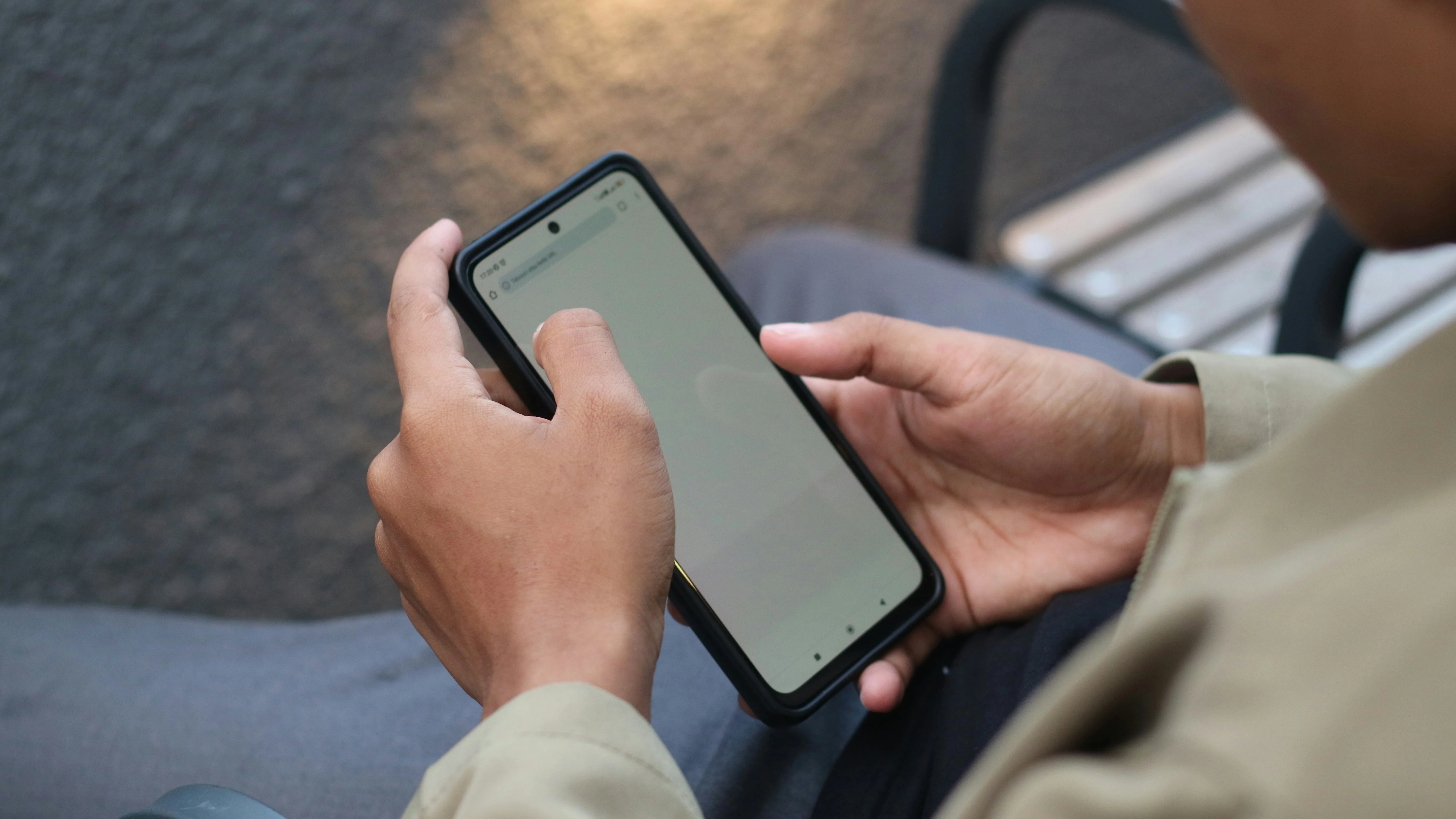 Person browsing products on a phone in a retail context
